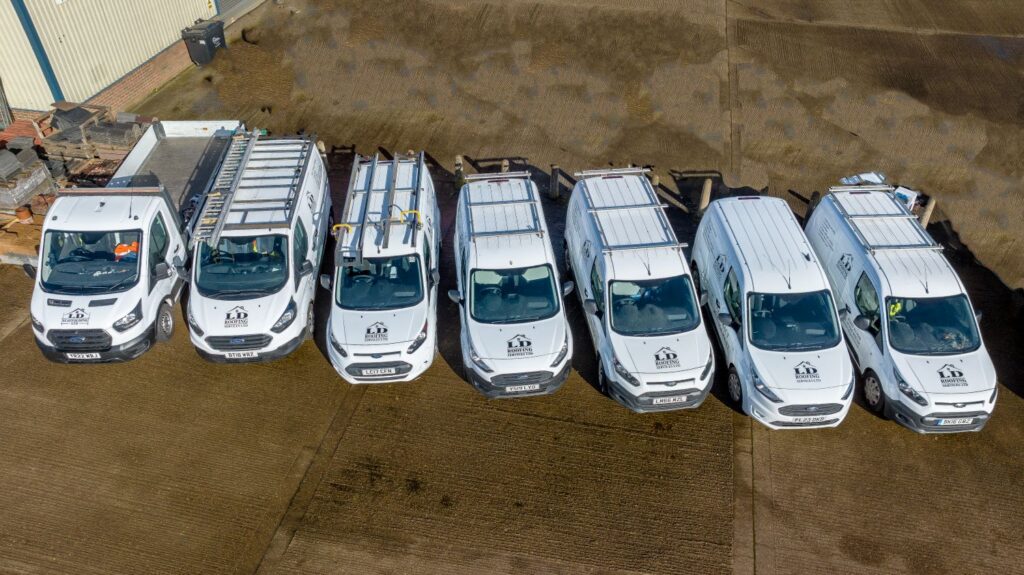 drone image of seven ld roofing vans