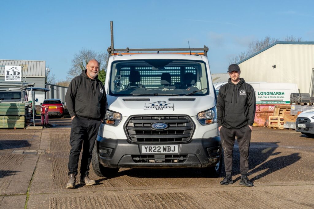 image of two ld roofing employees standing next to an ld roofing van