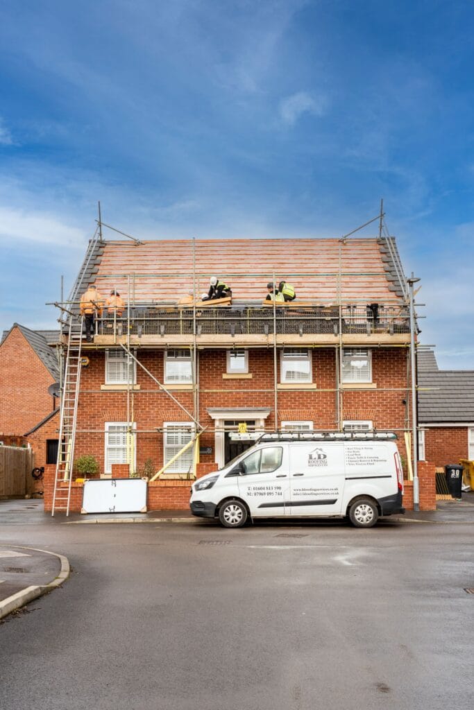 image of ld roofing workers on a roof