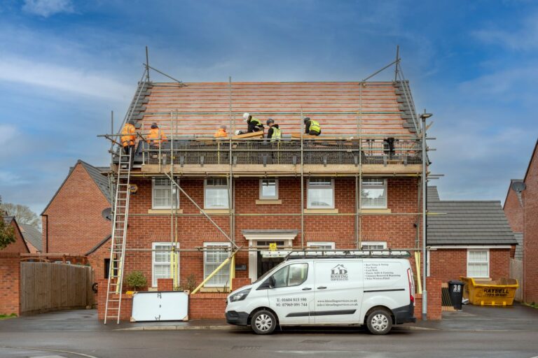 image of seven ld roofing employees working on a roof