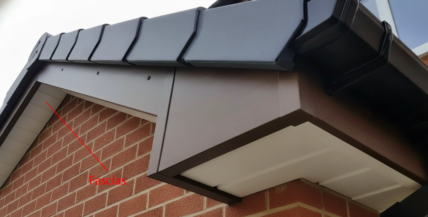 Close-up of a roof corner showing black tiles, red brick wall, and labeled fascia board. The image conveys a neat architectural detail.